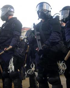 Police mobilize in full riot gear for a demonstration at the Republican National Convention