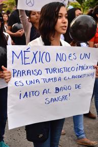 Protesters march against the police abduction of dozens of missing students